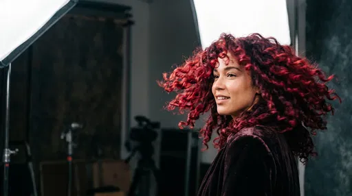Woman With Red Curls in Studio