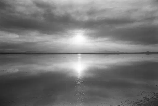 Monochrome Sunset Reflection Over Flooded Salt Flat