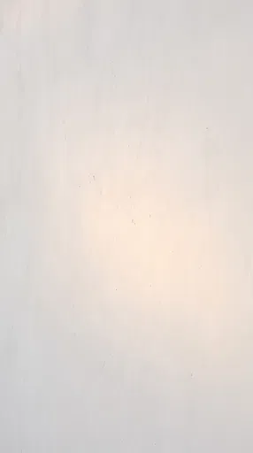 Warm Sunlight on Whitewashed Plaster Wall