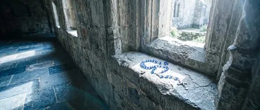 Blue Rosary on Monastery Stone Windowsill