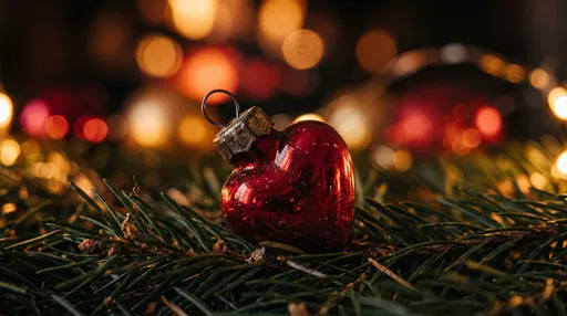 Red Glass Heart Ornament on Pine Needles