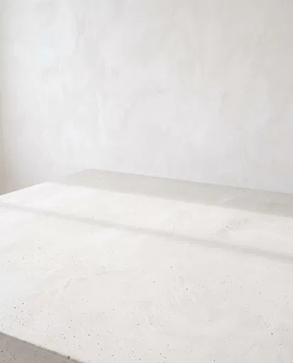 Minimalist White Concrete Tabletop and Plaster Wall