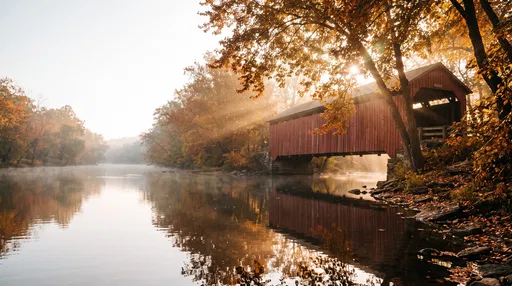 Red Covered Bridge in Autumn Mist