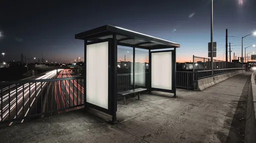 Empty Bus Shelter on Overpass at Night