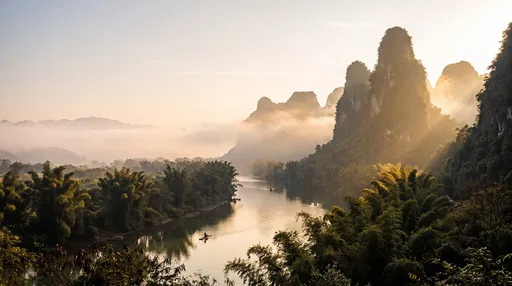 Misty Karst Mountains and River at Dawn