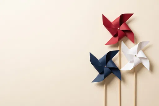 Patriotic Paper Pinwheels on Cream Background