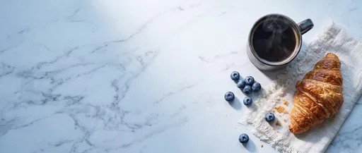 Coffee and Croissant on Marble Table