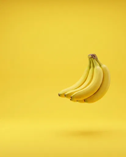 Floating Yellow Bananas on Studio Background