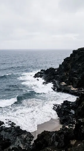 Jagged Volcanic Coastline With White Surf