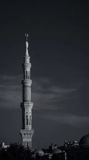 Monochrome Minaret Against Dark Sky