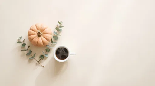Minimalist Autumn Pumpkin and Coffee Flat Lay