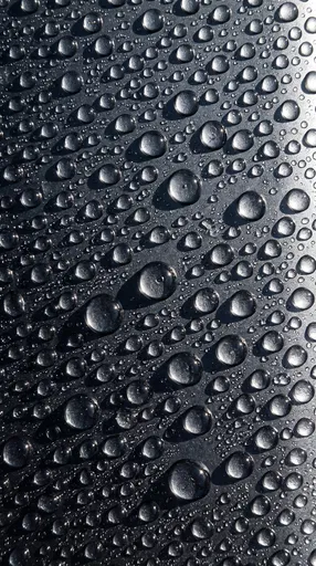 Water Droplets on Dark Metallic Surface