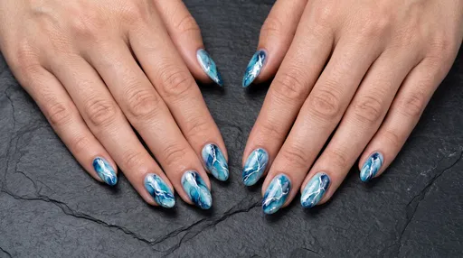 Blue Marble Glacier Nail Art on Hands