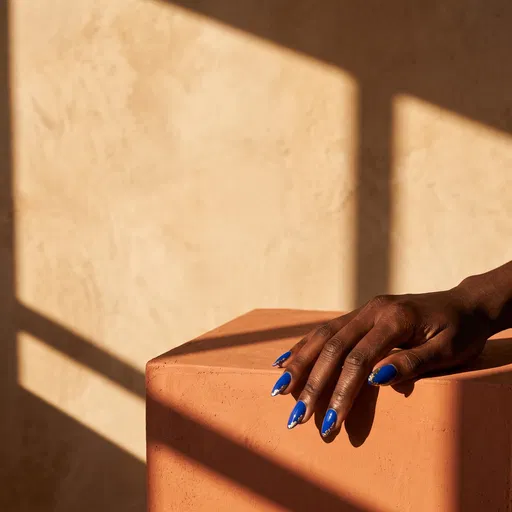 Cobalt Blue And Gold Manicure On Plinth