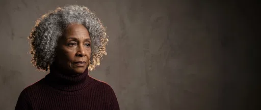 Thoughtful Senior Woman Studio Portrait