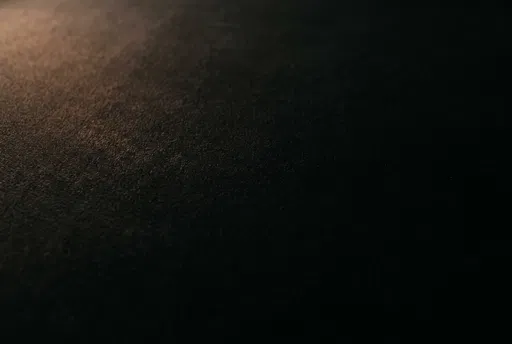 Warm Lit Dark Velvet Texture Background