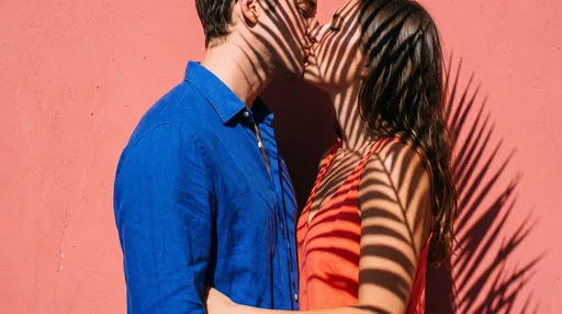 Couple Kissing Under Palm Shadows
