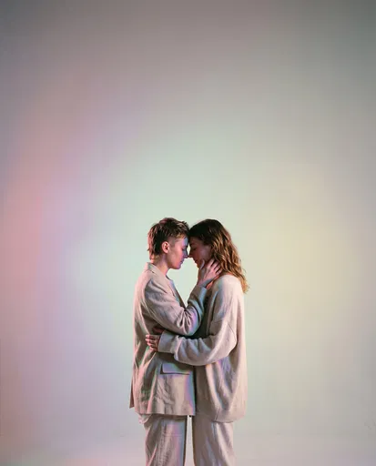 Couple Embracing in Pastel Studio Light
