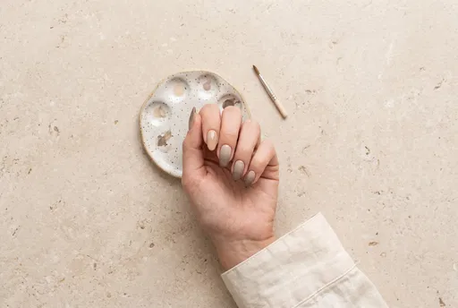 Neutral Ombre Manicure on Limestone Counter