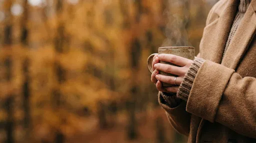 Woman Holding Warm Mug in Autumn