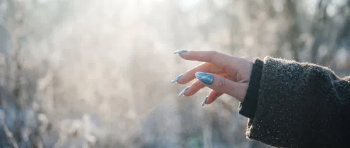 Hand With Ice Blue Winter Manicure