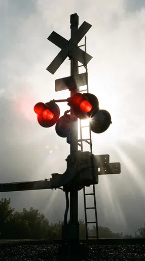 Backlit Railroad Crossing Signal with Red Lights