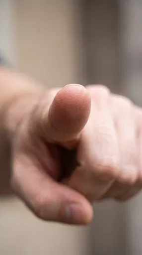 Macro Finger Pointing at Camera