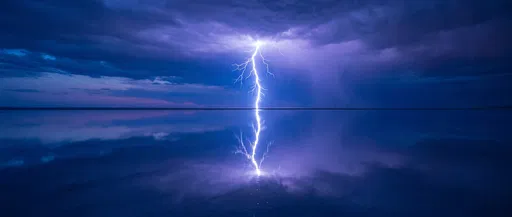 Symmetrical Lightning Strike Over Calm Water