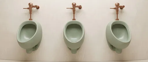 Three Sage Green Ceramic Urinals