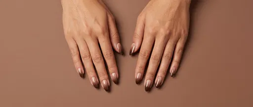 Woman Hands With Brown Ombre Manicure