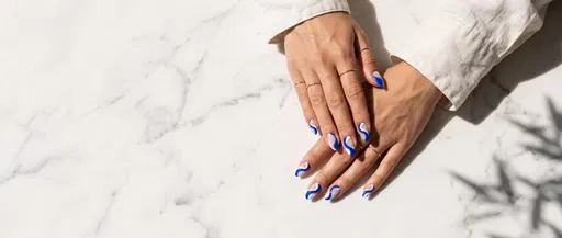 Hands With Blue Swirl Nail Art