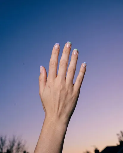 Hand With Pastel French Tip Nail Art