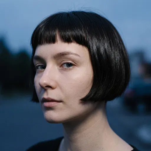 Woman With Dark Micro-Bob Haircut At Dusk