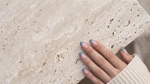 Hand With Blue French Tip Manicure