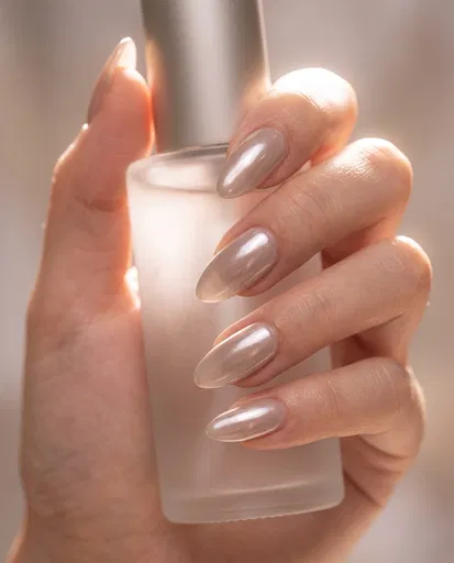 Hand With Pearl Chrome Almond Nails