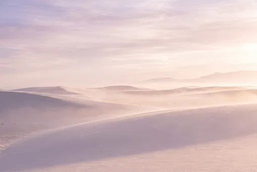 Pastel Sunrise Mist Over White Sand Dunes