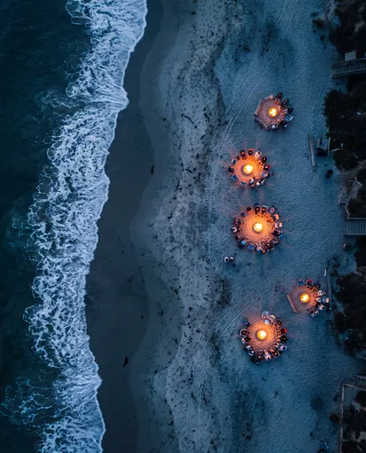 Aerial View of Beach Bonfires at Twilight