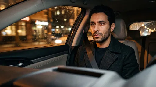 Pensive Man in Car at Night