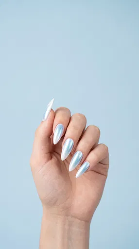 Hand With Icy Blue Pearl Stiletto Nails