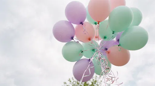 Pastel Helium Balloons in Overcast Sky