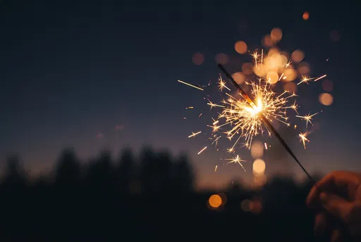 Burning Sparkler at Twilight with Bokeh