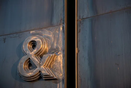Stepped Steel Ampersand on Metal Wall