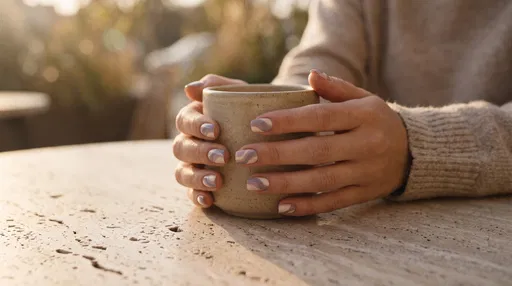 Hands With Purple Swirl Nail Art Holding Cup