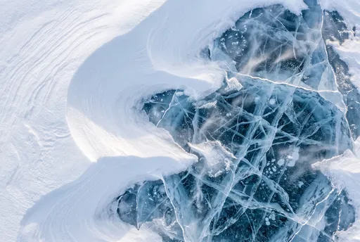 Overhead View of Snow and Cracked Ice