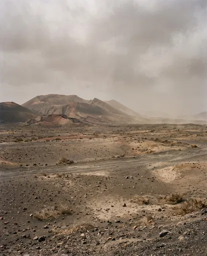 Barren Volcanic Plain Under Dusty Sky