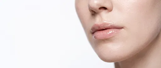 Close-Up of Glossy Lips and Fair Skin