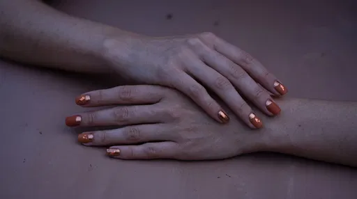 Hands With Terracotta and Bronze Nail Art