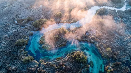 Aerial View of Misty Turquoise Spring