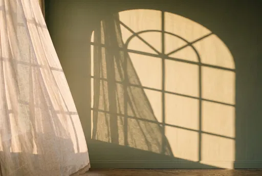 Golden Arched Window Shadow on Sage Wall