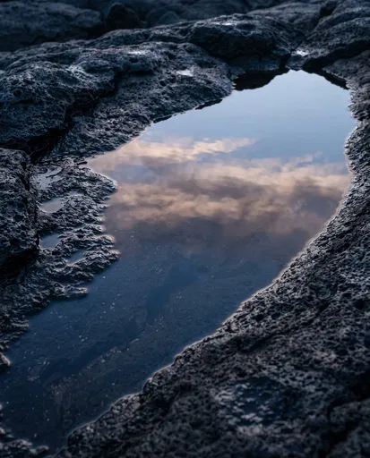 Sunset Reflection in Volcanic Rock Puddle